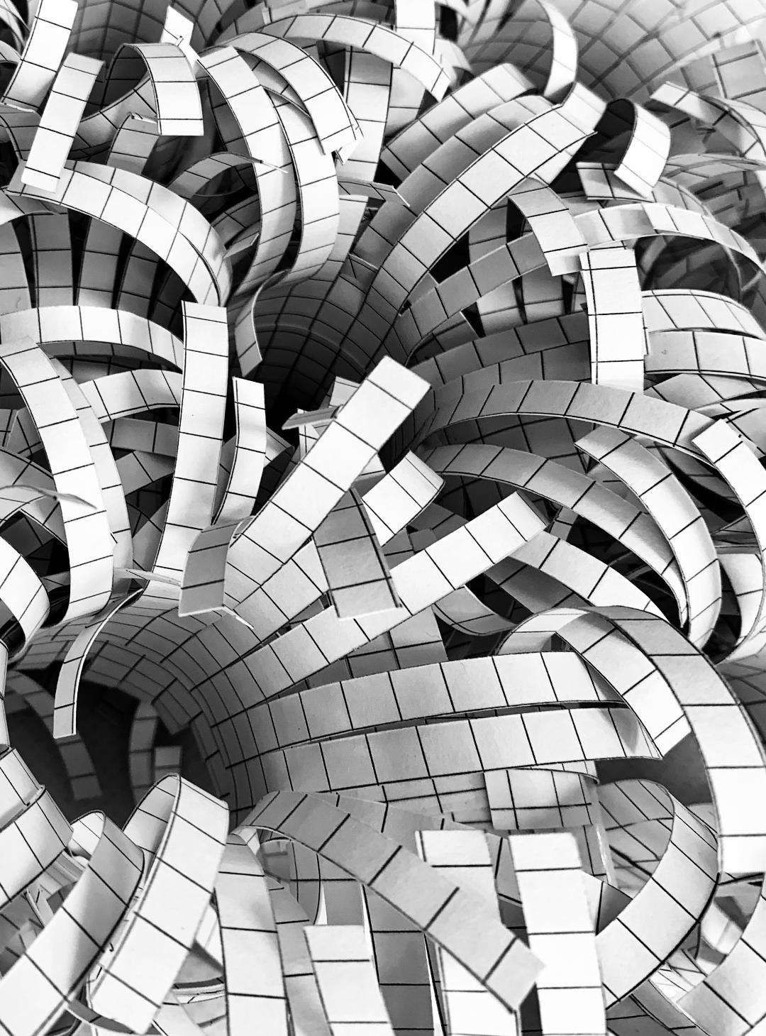 Close view of a black-and-white folded paper structure